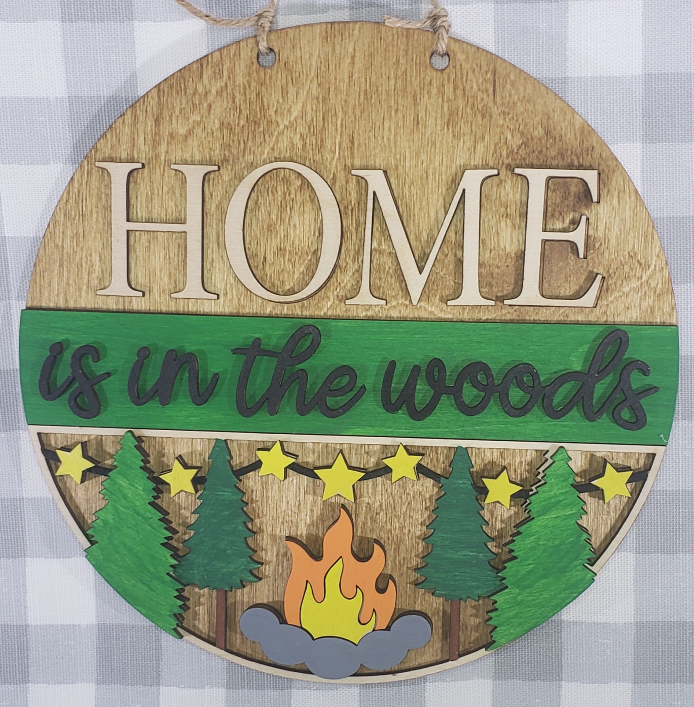 a wooden sign that says home is the best place to live