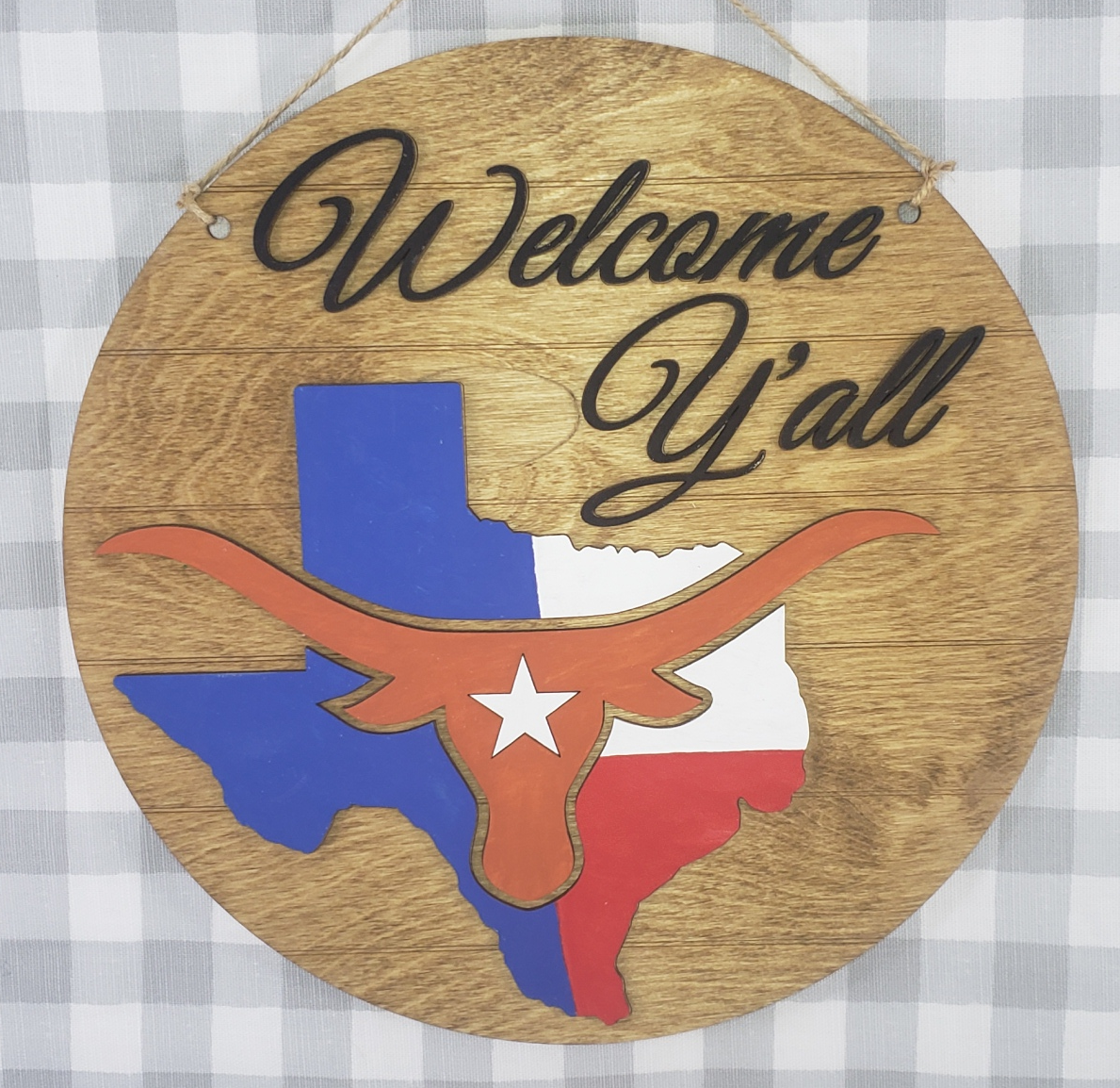 a wooden sign with a picture of a woman on it