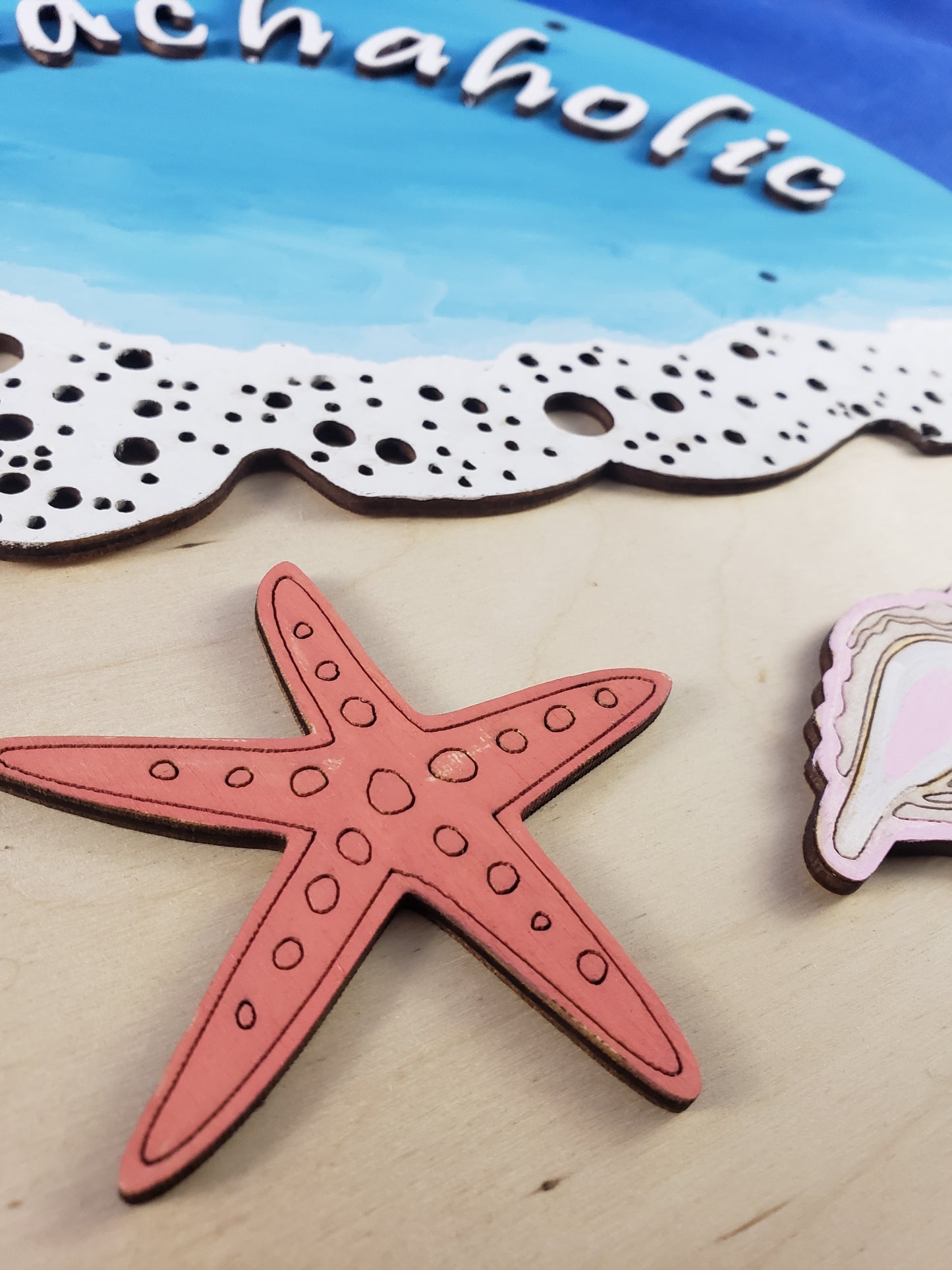a pink starfish and a pink sticker on a table