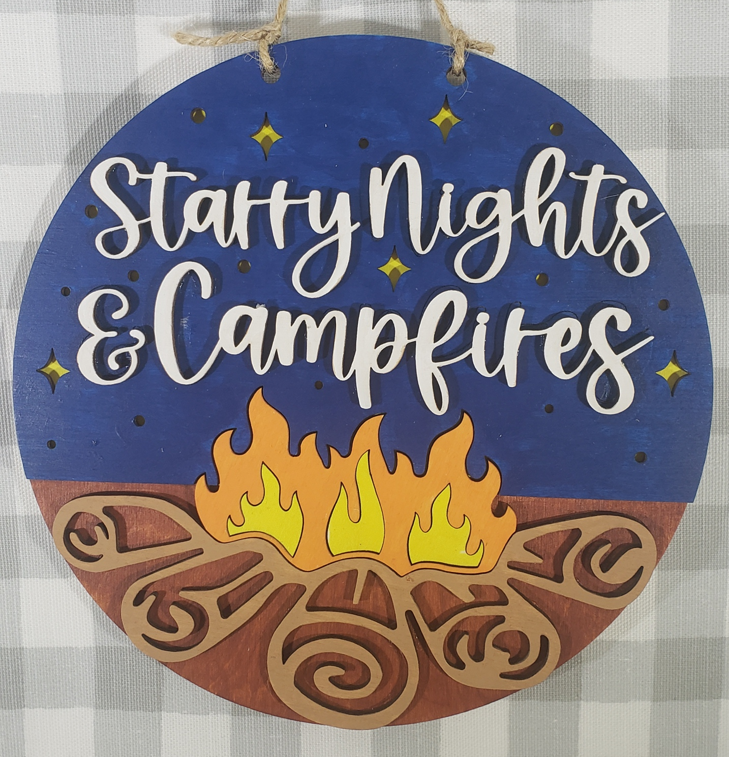 a blue sign with a sun and stars on it